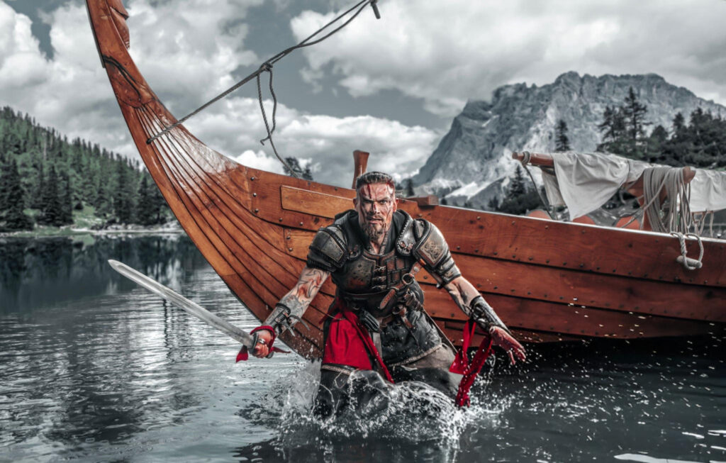 "Viking longships approaching a coastal village, with warriors ready for battle during the Viking invasions of the 8th and 9th centuries."