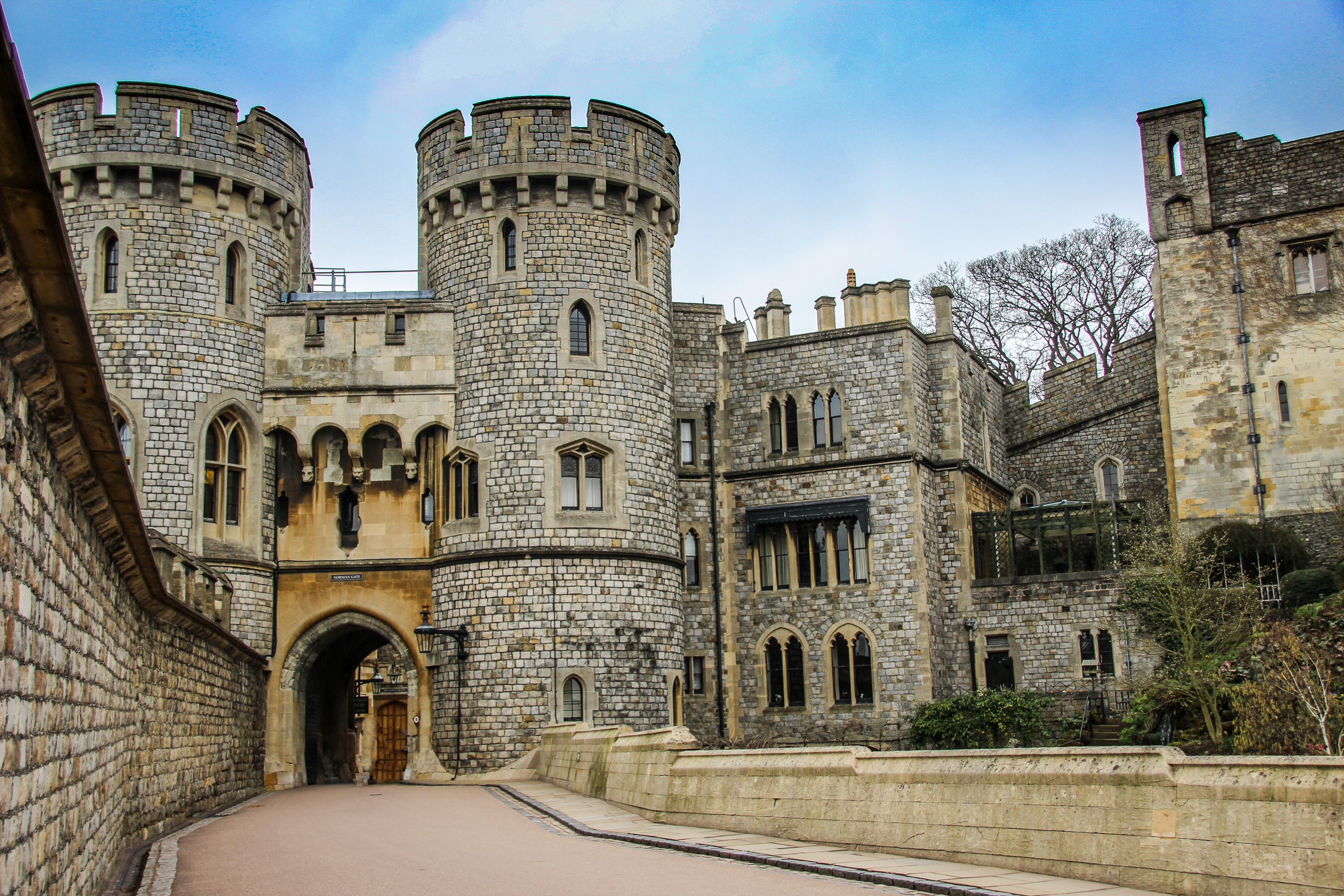 The Norman gate of Windsor Castle, showcasing its medieval architecture and imposing stone structure.