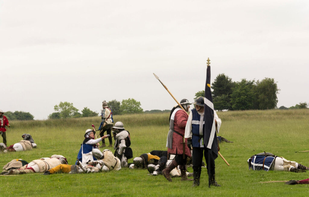 "Illustration depicting a medieval battle scene during the Hundred Years' War between England and France."