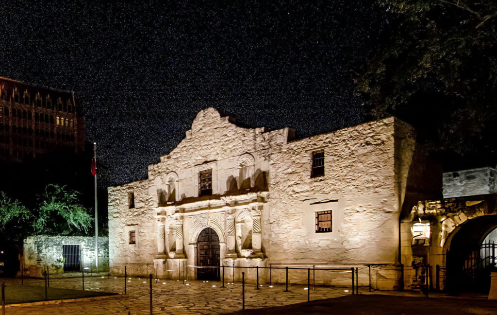 A dramatic depiction of the 1836 Battle of the Alamo, showing Texian defenders fighting against a larger Mexican force during Texas' struggle for independence.