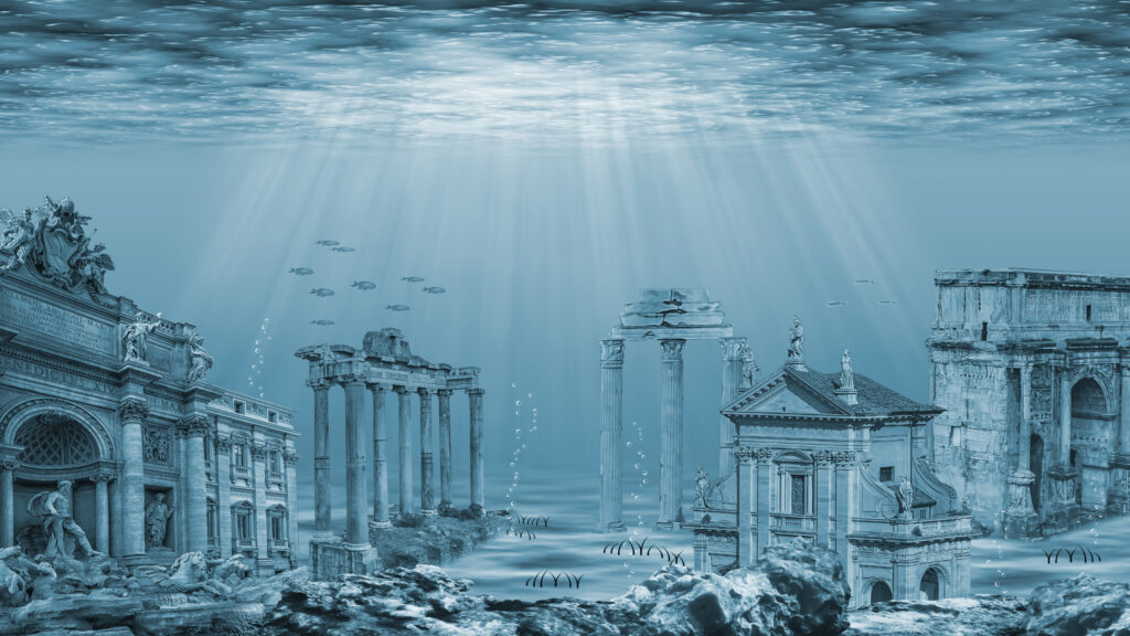 Underwater ruins of the lost Atlantis civilization, with towering columns, statues, and coral growth illuminated by sunlight.